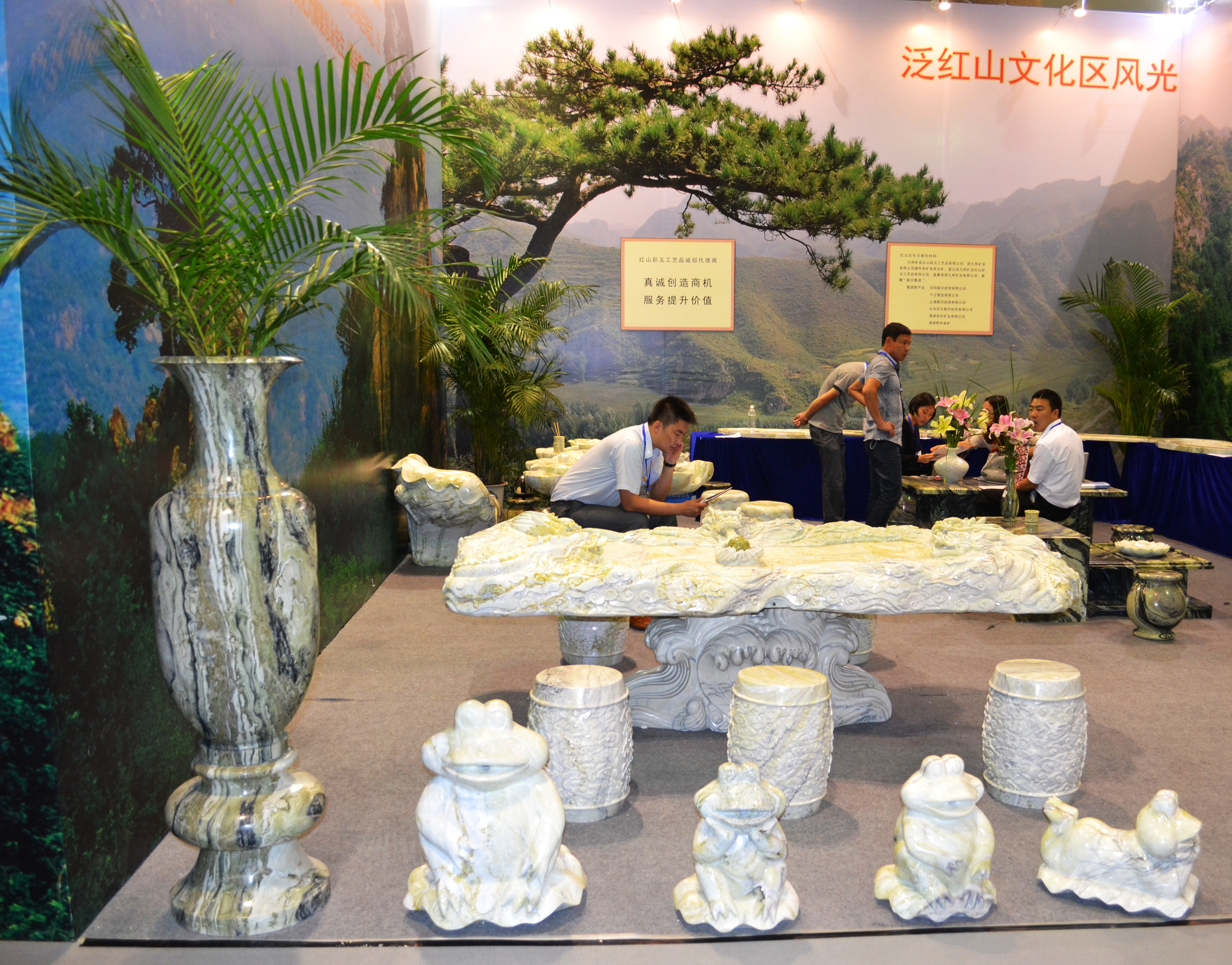 Carved stone tea tables at the Beijing International Tea Expo 2012. [Corey Cooper/china.org.cn]