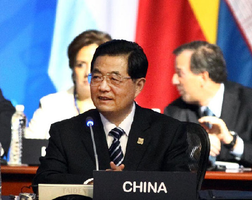 Chinese President Hu Jintao addresses the seventh Leaders' Summit of the Group of Twenty (G20) in Los Cabos, Mexico, June 18, 2012.