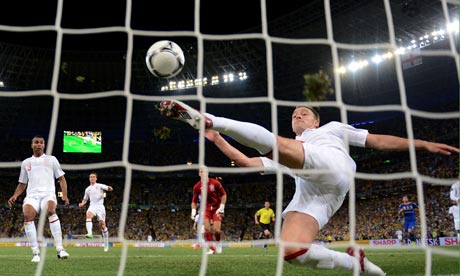 England's John Terry clears the ball, but not before it has crossed the goalline, against Ukraine. 