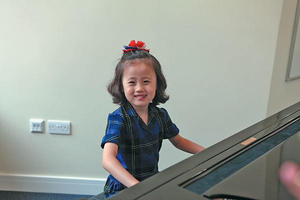 Mimi Zhou plays at the opening ceremony of Wellington College's Mandarin center in London in June. [ Photo / China Daily ]