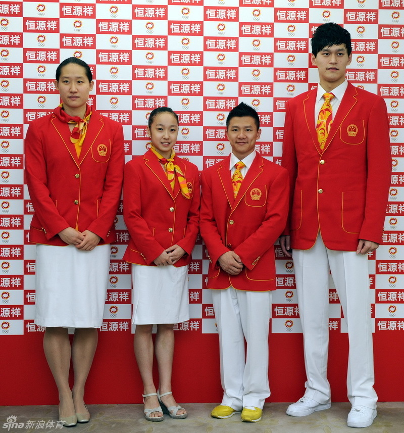 Chinese athletes Liu Zige, left, Huang Qiu, Chen Yibing and Sun Yang show off the official uniforms for the Chinese national team for London Olympic Games at an unveiling ceremony in Beijing, June 25, 2012. [Photo/Xinhua]