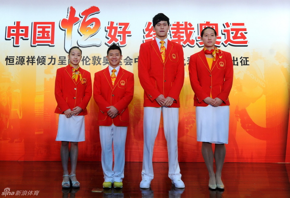 Chinese athletes Huang Qiu, left, Chen Yibing, Sun Yang and Liu Zige show off the official uniforms for the Chinese national team for London Olympic Games at an unveiling ceremony in Beijing, June 25, 2012. [Photo/Xinhua] 