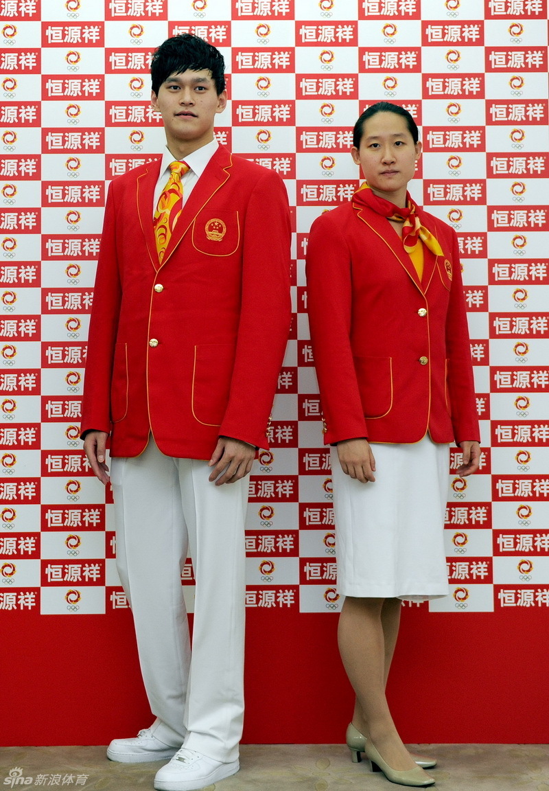 Chinese athletes Sun Yang, left, and Liu Zige show off the official uniforms for the Chinese national team for London Olympic Games at an unveiling ceremony in Beijing, June 25, 2012. [Photo/Xinhua] 