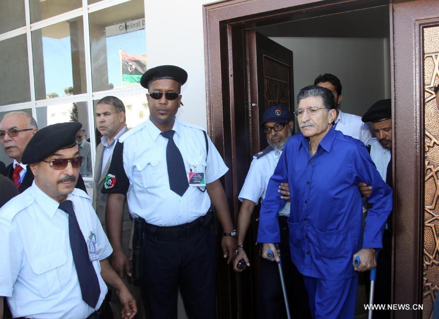 Bouzid Dorda (R), the intelligence chief of Libya's former regime, is seen during his trial at a court in Tripoli, Libya, June 26, 2012. The trial against Dorda began in a Tripoli court on Tuesday. Dorda was captured by the then-opposition's forces during the 2011 turmoil that eventually led to the downfall of Gaddafi.