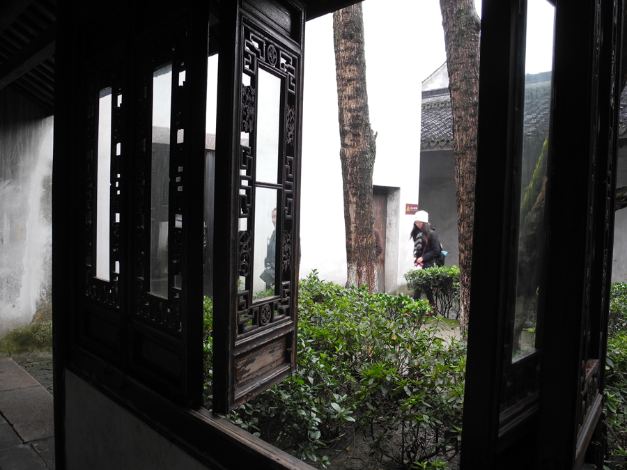 With a history of 1,200-years, Wuzhen is about one hour's drive from Hangzhou, the capital of Zhejiang province. The small town is famous for the ancient buildings and old town layout, where bridges of all sizes cross the streams winding through the town.[Photo by Chen Baojian/China.org.cn]