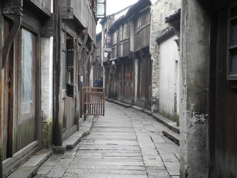 With a history of 1,200-years, Wuzhen is about one hour's drive from Hangzhou, the capital of Zhejiang province. The small town is famous for the ancient buildings and old town layout, where bridges of all sizes cross the streams winding through the town.[Photo by Chen Baojian/China.org.cn]