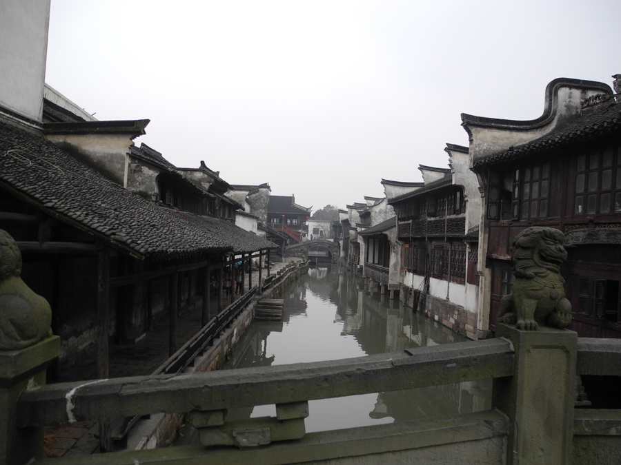 With a history of 1,200-years, Wuzhen is about one hour's drive from Hangzhou, the capital of Zhejiang province. The small town is famous for the ancient buildings and old town layout, where bridges of all sizes cross the streams winding through the town.[Photo by Chen Baojian/China.org.cn]