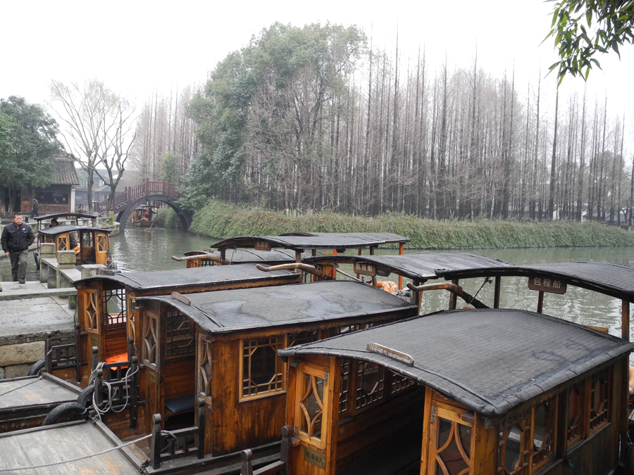 With a history of 1,200-years, Wuzhen is about one hour's drive from Hangzhou, the capital of Zhejiang province. The small town is famous for the ancient buildings and old town layout, where bridges of all sizes cross the streams winding through the town.[Photo by Chen Baojian/China.org.cn]