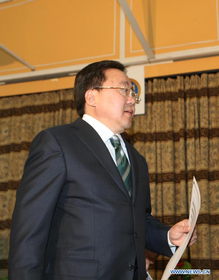 Mongolian President Tsakhia Elbegdorj prepares to cast his ballot at a polling station in Ulan Bator, capital of Mongolia, on June 28, 2012. Mongolia held the State Great Hural (parliament) election on Thursday. (Xinhua/Shi Yongchun) 