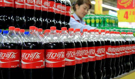 The Coca-Cola Company has announced that it will take measures to change its production process in China in order to decrease the amount of a cancer-causing chemicals in the soda drink.