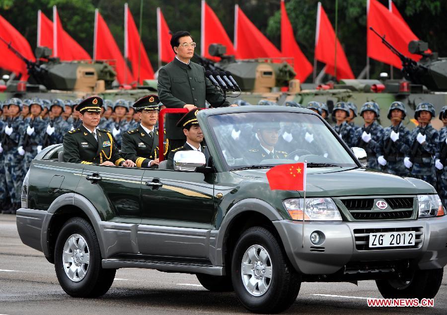 Hu Jintao, general secretary of the Central Committee of the Communist Party of China, Chinese president and chairman of the Central Military Commission, reviews the Chinese People's Liberation Army (PLA) Garrison in the Hong Kong Special Administrative Region (HKSAR), at the Shek Kong barracks in Hong Kong, south China, June 29, 2012.