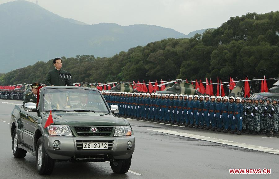 Chinese President Hu Jintao, who is also general secretary of the Central Committee of the Communist Party of China and chairman of the Central Military Commission, inspects the Chinese People's Liberation Army (PLA) Garrison in the Hong Kong Special Administrative Region (HKSAR), at the Shek Kong barracks in Hong Kong, south China, June 29, 2012.