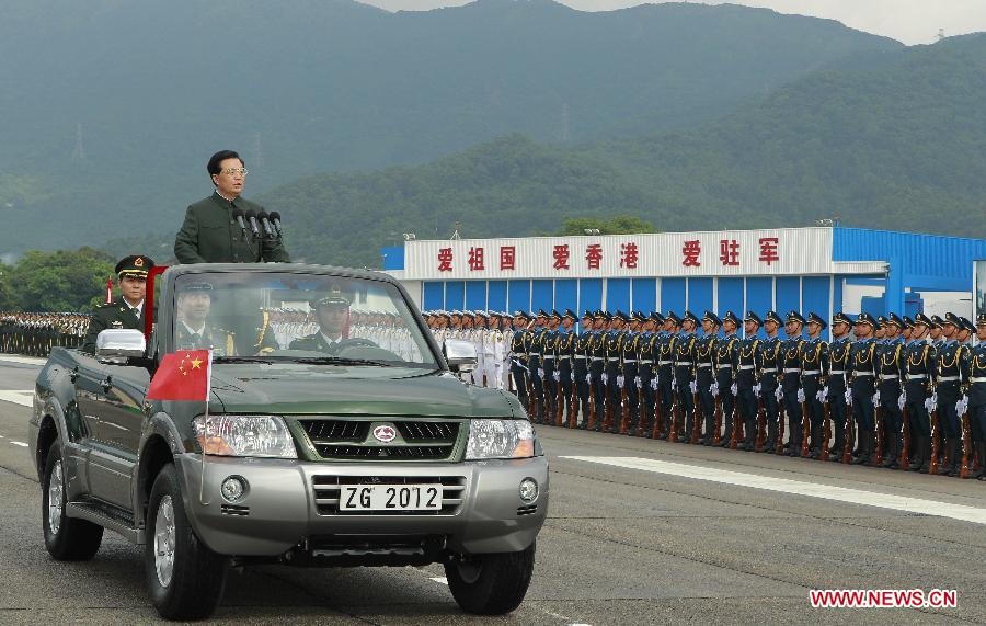 Chinese President Hu Jintao, who is also general secretary of the Central Committee of the Communist Party of China and chairman of the Central Military Commission, inspects the Chinese People's Liberation Army (PLA) Garrison in the Hong Kong Special Administrative Region (HKSAR), at the Shek Kong barracks in Hong Kong, south China, June 29, 2012.