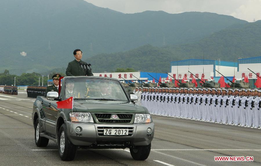 Chinese President Hu Jintao, who is also general secretary of the Central Committee of the Communist Party of China and chairman of the Central Military Commission, inspects the Chinese People's Liberation Army (PLA) Garrison in the Hong Kong Special Administrative Region (HKSAR), at the Shek Kong barracks in Hong Kong, south China, June 29, 2012.