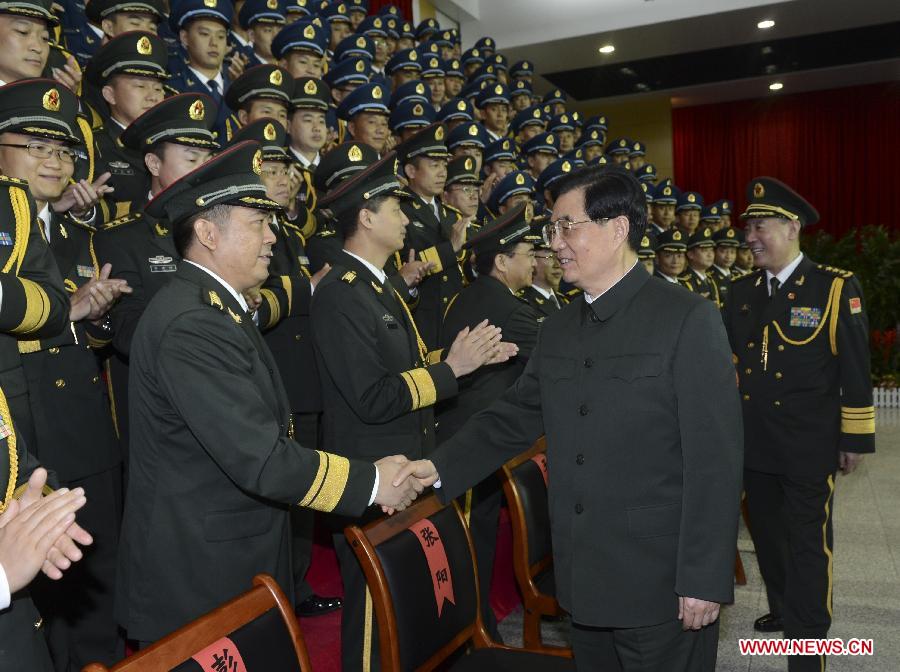 Chinese President Hu Jintao (R, front), who is also general secretary of the Central Committee of the Communist Party of China and chairman of the Central Military Commission, meets with officers of the Chinese People's Liberation Army (PLA) Garrison in the Hong Kong Special Administrative Region (HKSAR), at the Shek Kong barracks in Hong Kong, south China, June 29, 2012. 