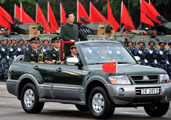 Hu Jintao, general secretary of the Central Committee of the Communist Party of China, Chinese president and chairman of the Central Military Commission, reviews the Chinese People's Liberation Army Garrison in the Hong Kong Special Administrative Region (HKSAR), at the Shek Kong barracks in Hong Kong, June 29, 2012. 