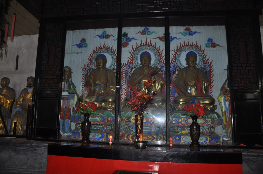 The Baoguang Temple is located in Xindu district 18 km north of Chengdu, China's Sichuan province. It was founded during the Tang Dynasty. The temples has a number of halls, including the Qing-era Arhat Hall, containing 500 two meter high clay figurines of Arhats. [China.org.cn /by Chen Xiangzhao]