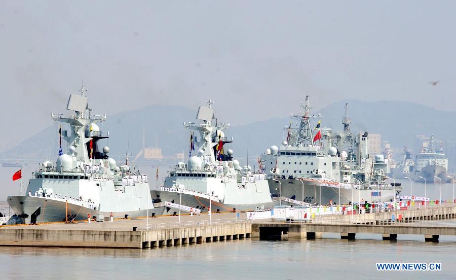 The 12th Chinese naval escort flotilla prepare to set sail at a port in Zhoushan, east China's Zhejiang Province, July 3, 2012