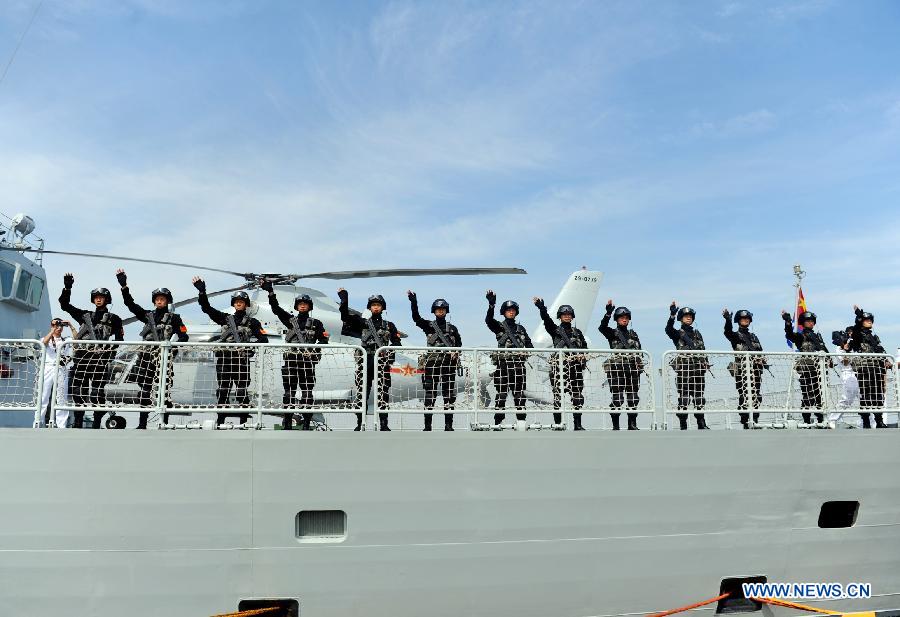 Special force soldiers of the 12th Chinese naval escort flotilla bid farewell at a port in Zhoushan, east China's Zhejiang Province, July 3, 2012