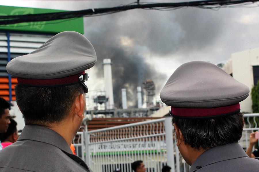 Black smoke rises after an explosion at the Bangchak oil refinery and depot in Bangkok, Thailand, July 4, 2012.