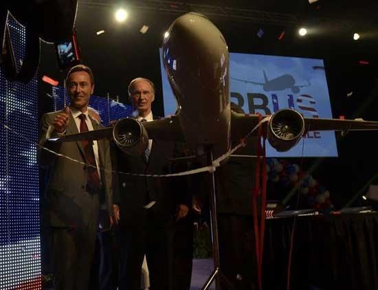 Airbus President and CEO Fabrice Bregier, left, is joined by Alabama Gov. Robert Bentley amid confetti and streamers after announcing the decision to create an A320 Family final assembly line at the Brookley Aeroplex in Mobile, Ala. [Airbus]