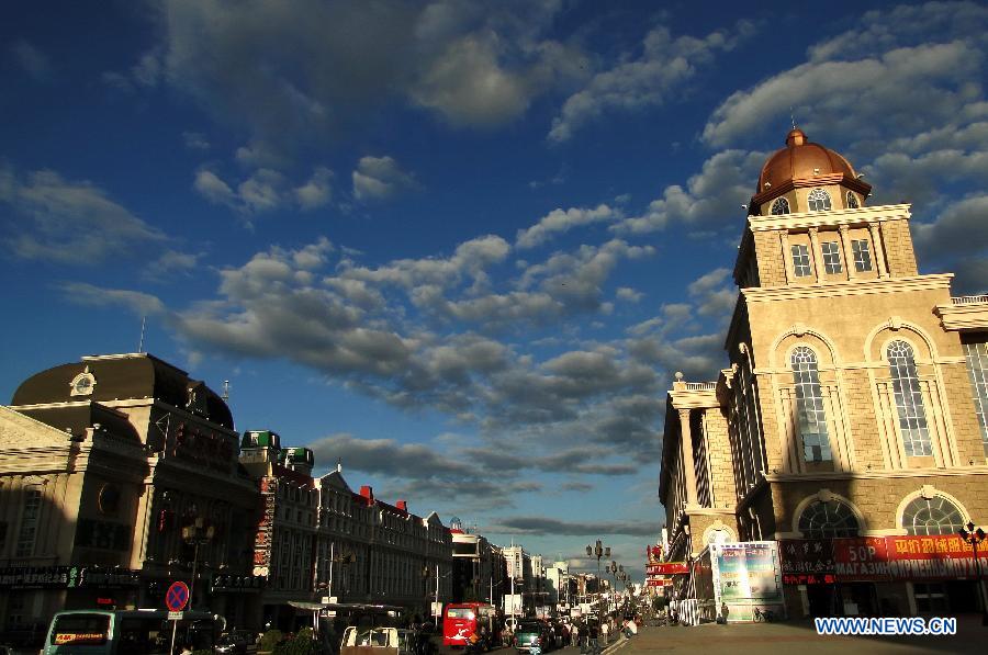 Photo taken on July 3, 2012 shows a statue of musicians surrounded by Russian style architecture in Manzhouli city, north China's Inner Mongolia Autonomous Region