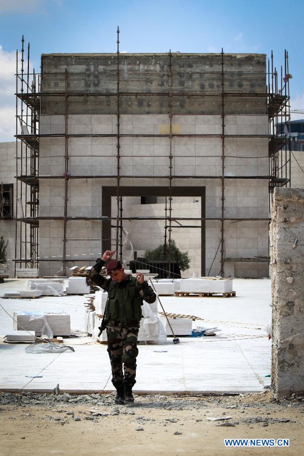 A Palestinian security soldier guards the mausoleum built over the grave of the late Palestinian leader Yasser Arafat in West Bank City of Ramallah on July 5, 2012. The Palestinian National Authority (PNA) has agreed to exhume late President Yasser Arafat&apos;s body for examination upon a request of some of his family members, a spokesman said Wednesday. (Xinhua/Chen Xu)