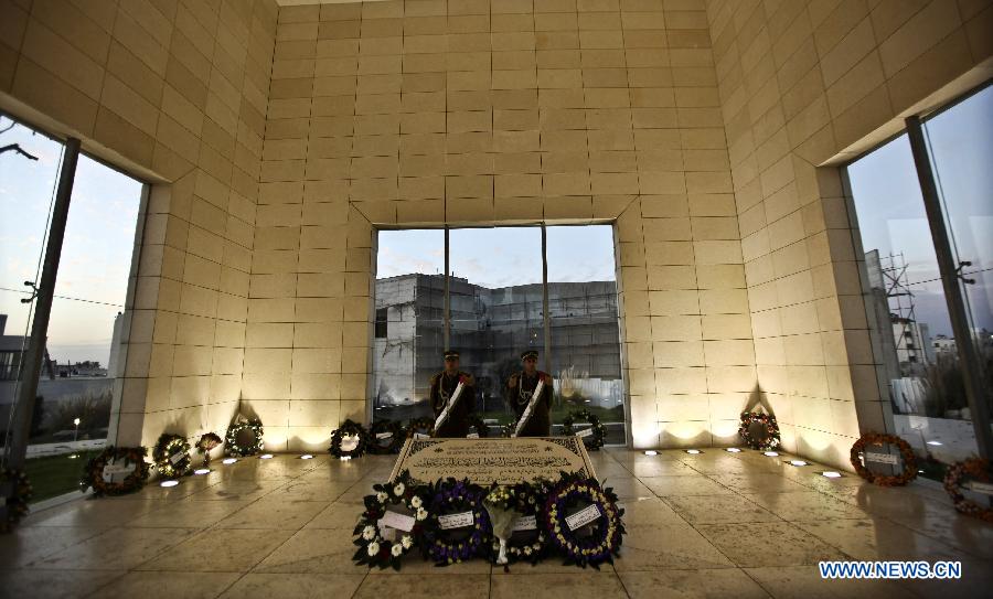 File photo taken on Nov. 11, 2011, shows Palestinian honor guards stand by late Palestinian leader Yasser Arafat's grave in the West Bank city of Ramallah. The Palestinian National Authority (PNA) agreed on July 4 to exhume late President Yasser Arafat's body for examination upon a request from some of his family members. (Xinhua/Fadi Arouri) 