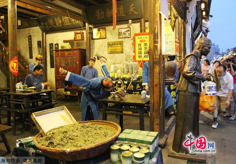 As one of the most famous historic streets in Hangzhou, Qinghefang Street reflects the social features of the Southern Song Dynasty (1127-1279). Taking a stroll along this street, you will be attracted by the antique buildings and local crafts, such as silk parasols, brocades, renowned Zhang Xiaoquan scissors and Hangzhou fans. [China.org.cn]