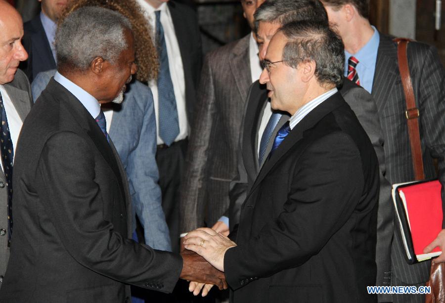 UN-Arab League joint special envoy Kofi Annan (L) shakes hands with Syrian Deputy Foreign Minister Faisal Mekdad upon his arrival in Damascus, Syria on July 8, 2012. 