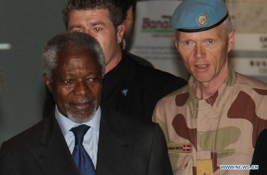 UN-Arab League joint special envoy Kofi Annan (L) and General Robert Mood (R), head of UN monitors in Syria, are seen upon Annan's arrival in Damascus, Syria on July 8, 2012. 