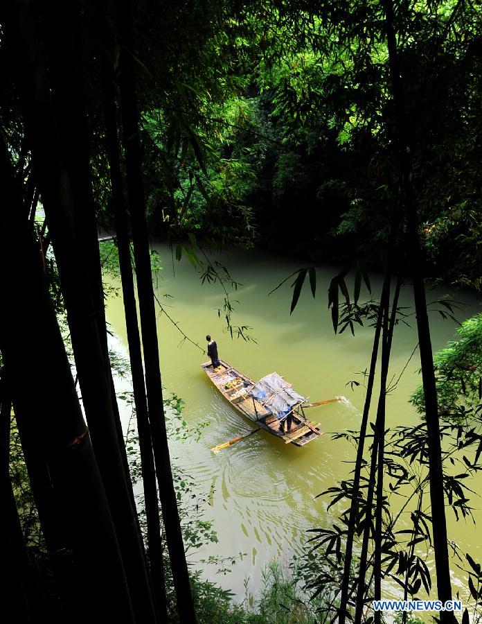 A sight-seeing boat sails on water at a resort in the Xiling Gorge, the easternmost of the Three Gorges along the Yangtze River, in Yichang, central China's Hubei Province, July 8, 2012. Tourism revenue has soared in recent years as the resort incorporated both natural scenery and local ethnic culture in its operation. (Xinhua/Chen Haining) 