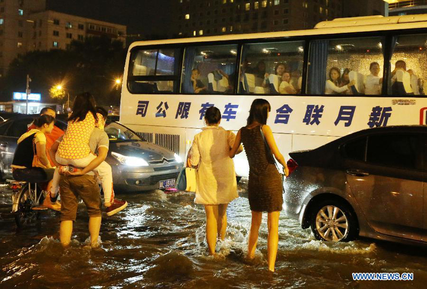 Beijing was hit by a torrential rain on Tuesday evening. 