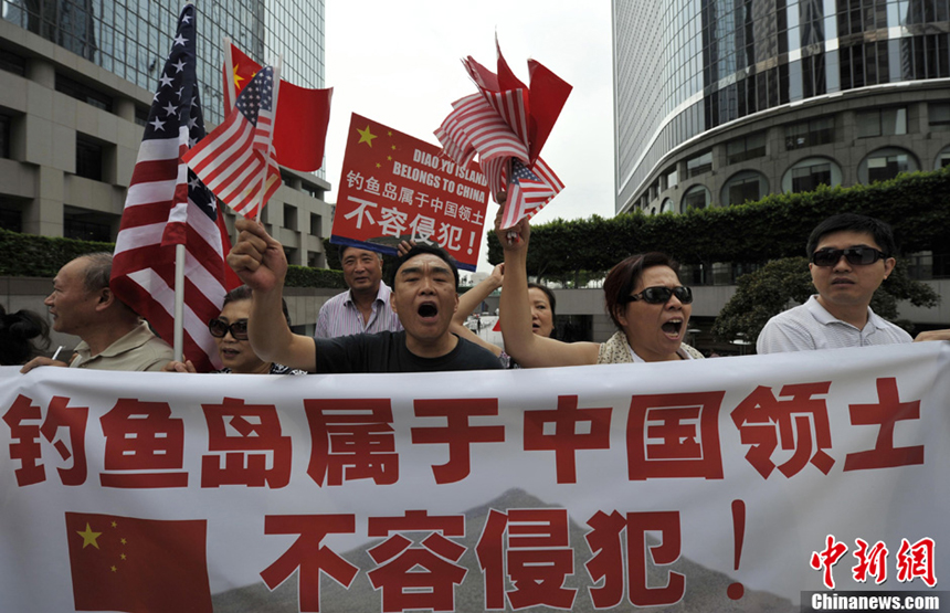 Dozens of Chinese led by Cai Chenghua, president of the Chinese American Federation in California, demonstrate in front of the Japanese Consulate in Los Angeles on July 12, 2012. They chant slogans to protest against Japanese Prime Minister Yoshihiko Noda's decision on the Diaoyu Islands. They also want to submit a letter of protest to the consulate.