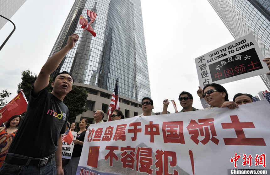 Dozens of Chinese led by Cai Chenghua, president of the Chinese American Federation in California, demonstrate in front of the Japanese Consulate in Los Angeles on July 12, 2012. They chant slogans to protest against Japanese Prime Minister Yoshihiko Noda's decision on the Diaoyu Islands. They also want to submit a letter of protest to the consulate.
