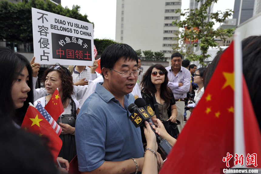 Dozens of Chinese led by Cai Chenghua, president of the Chinese American Federation in California, demonstrate in front of the Japanese Consulate in Los Angeles on July 12, 2012. They chant slogans to protest against Japanese Prime Minister Yoshihiko Noda's decision on the Diaoyu Islands. They also want to submit a letter of protest to the consulate.