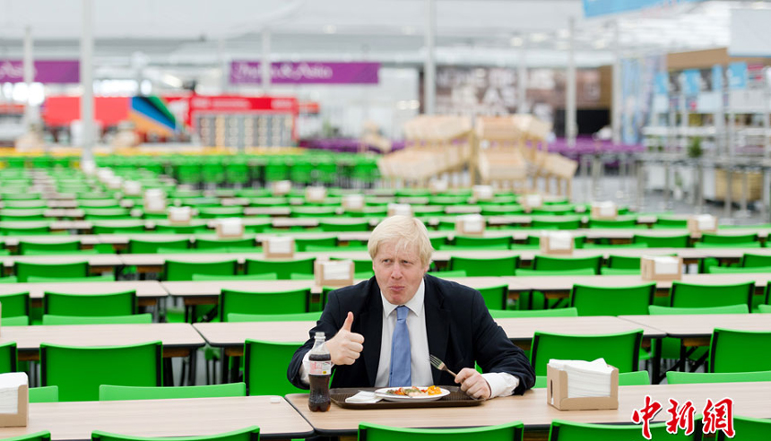 Mayor of London Boris Johnson tastes the food at the London Olympic Village on July 12, 2012. The village is located in the Olympic Park in east London. It will accommodate 16,000 athletes from more than 200 countries and regions during the Olympic Games this summer.