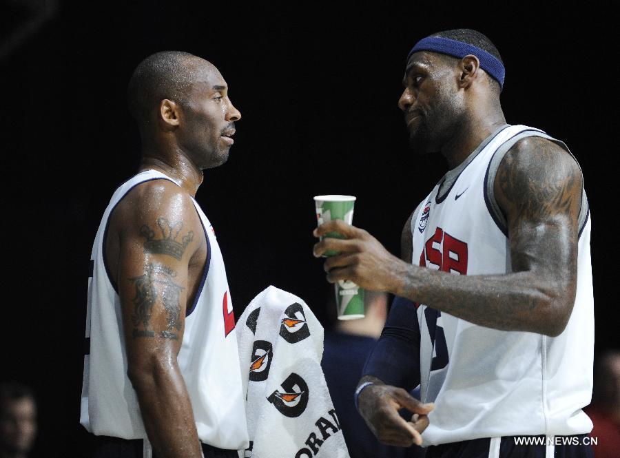 U.S. men's Olympic basketball team member LeBron James (R) talks with Kobe Bryant duing a training session of the team for the 2012 London Olympics, in Washington on July 14, 2012. (Xinhua/Zhang Jun)