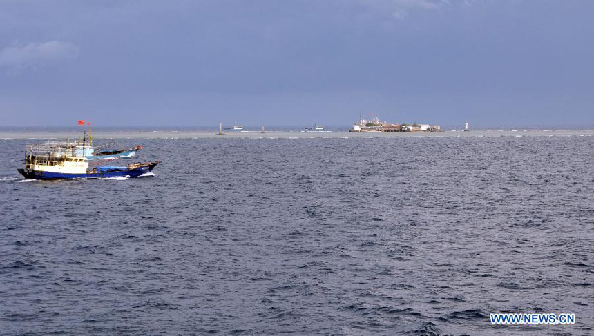 Fishing vessels arrive at Yongshu Reef of Nansha Islands, south China Sea, July 15, 2012. A fleet of 30 fishing vessels arrive at Yongshu Reef of south China Sea on Sunday. The fleet, departing from Sanya City of south China's Hainan Province on July 12, 2012, will spend 20 days fishing near the Yongshu Reef, sailors of the fleet said.