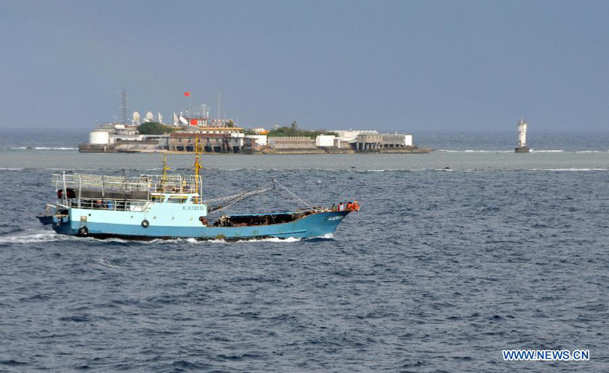 A fishing vessel arrives at Yongshu Reef of Nansha Islands, south China Sea, July 15, 2012. A fleet of 30 fishing vessels arrive at Yongshu Reef of south China Sea on Sunday. The fleet, departing from Sanya City of south China's Hainan Province on July 12, 2012, will spend 20 days fishing near the Yongshu Reef, sailors of the fleet said.