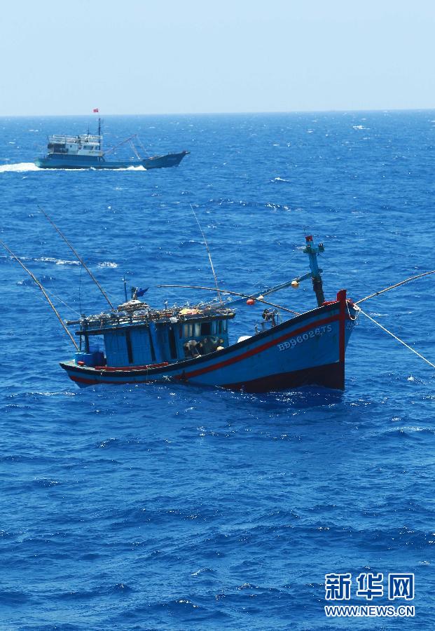 Fishing vessels arrive at Yongshu Reef of Nansha Islands, south China Sea, July 15, 2012. A fleet of 30 fishing vessels arrive at Yongshu Reef of south China Sea on Sunday. The fleet, departing from Sanya City of south China's Hainan Province on July 12, 2012, will spend 20 days fishing near the Yongshu Reef, sailors of the fleet said.