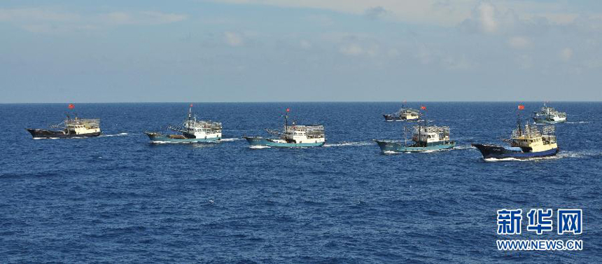 Fishing vessels arrive at Yongshu Reef of Nansha Islands, south China Sea, July 15, 2012. A fleet of 30 fishing vessels arrive at Yongshu Reef of south China Sea on Sunday. The fleet, departing from Sanya City of south China's Hainan Province on July 12, 2012, will spend 20 days fishing near the Yongshu Reef, sailors of the fleet said.