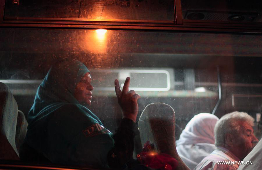 Relatives of Palestinian prisoners wait at a Red Cross's bus to visit Israeli prisons in Gaza City, on July 16, 2012. Israeli Prison service allowed families of 25 Gaza prisoners to visit them for the first time since 2007 after the capture of Israeli soldier Gilad Shalit by Hamas fighters, who was held in Gaza until last fall. 