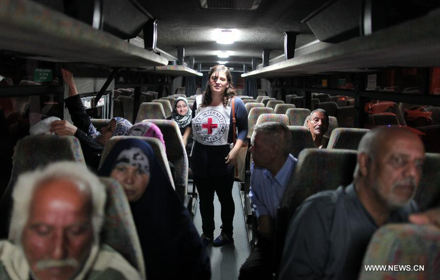 Relatives of Palestinian prisoners wait at a Red Cross's bus to visit Israeli prisons in Gaza City, on July 16, 2012. Israeli Prison service allowed families of 25 Gaza prisoners to visit them for the first time since 2007 after the capture of Israeli soldier Gilad Shalit by Hamas fighters, who was held in Gaza until last fall. 