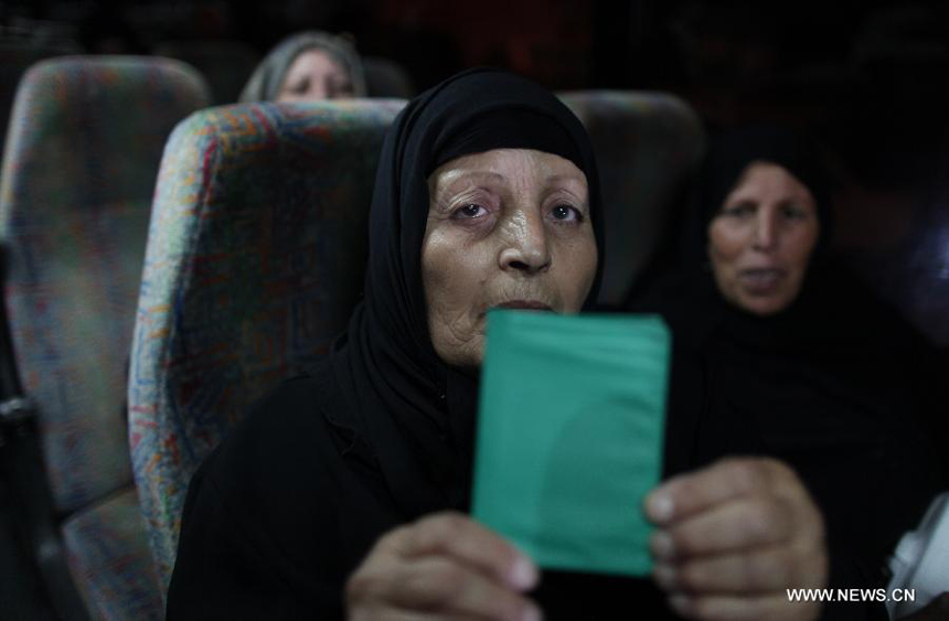 Relatives of Palestinian prisoners wait at a Red Cross's bus to visit Israeli prisons in Gaza City, on July 16, 2012. Israeli Prison service allowed families of 25 Gaza prisoners to visit them for the first time since 2007 after the capture of Israeli soldier Gilad Shalit by Hamas fighters, who was held in Gaza until last fall. 