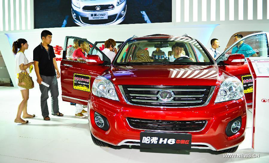 People visit the 9th China (Changchun) International Automobile Expo in Changchun, capital of northeast China's Jilin Province, July 16, 2012.