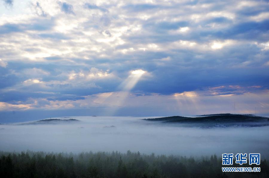 Photo taken on July 13, 2012 shows the scenery of Wuyiling wetlands enveloped in a morning fog in Yichun, northeast China's Heilongjiang Province. The Wuyiling Wetlands Natural Reserve has the highest wetlands in Lesser Khingan and the largest permafrost islets, containing a rich diversity of flora and fauna. [Xinhua]