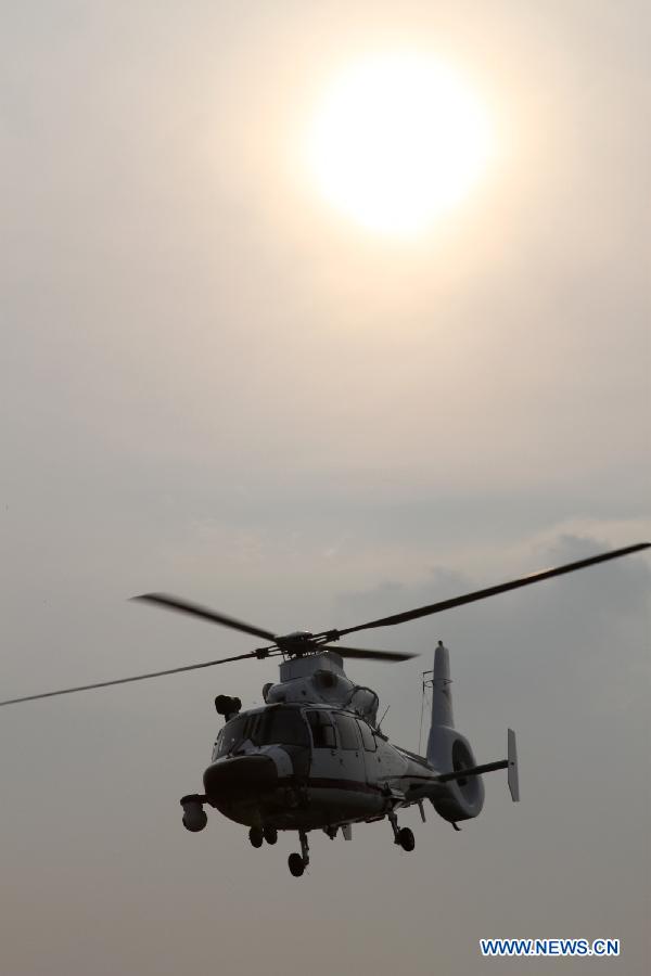 A police helicopter cruises in Hefei, capital of east China&apos;s Anhui Province, July 18, 2012. The helicopter with functions for police guard and fire fighting started its official cruise in Hefei on Wednesday. (Xinhua/Zhang Duan) 