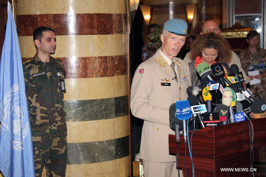 Major-General Robert Mood (2nd L), head of United Nations Supervision Mission in Syria (UNSMIS), speaks during a press conference in Damascus, Syria, on July 19, 2012. 