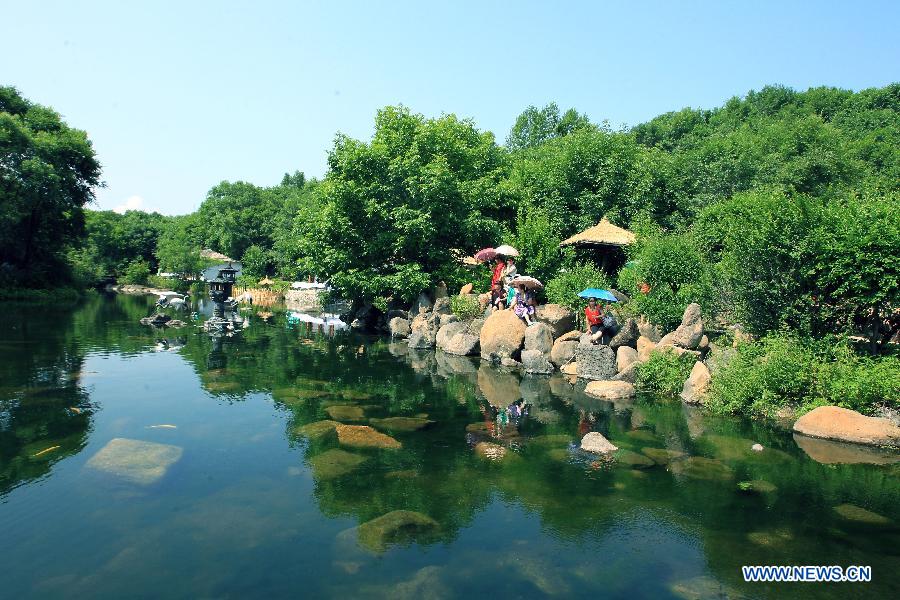 Photo taken on July 7, 2012 shows the scenery of the Jingbo Lake in Ning'an, northeast China's Heilongjiang Province. (Xinhua/Zhang Yanhui) 